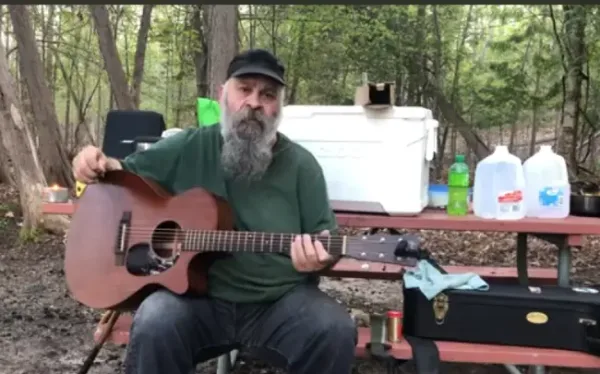 Little Robert playing his original song Baby's Arms