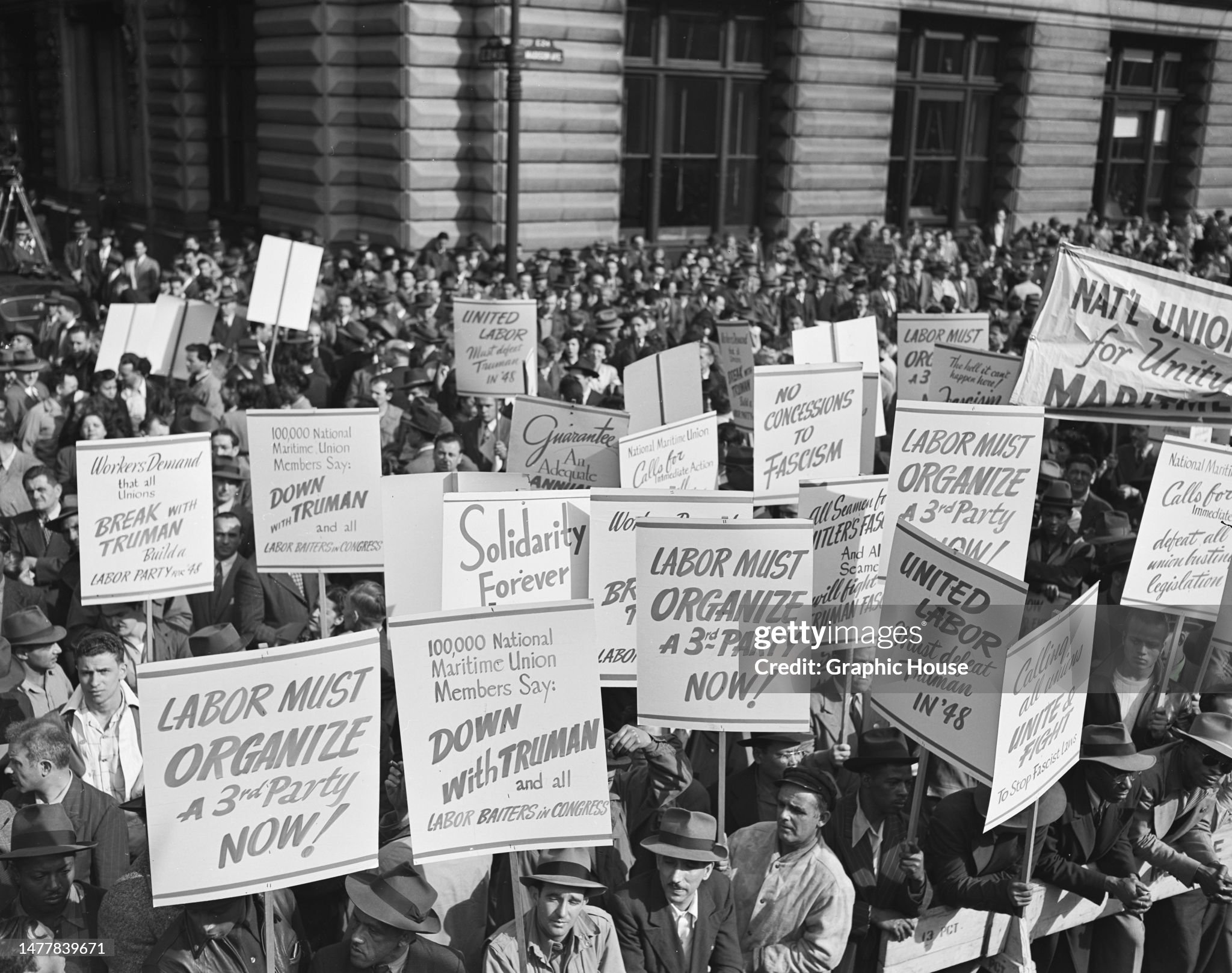 Mid-20th century union members marching for worker rights.. Source: Graphic House / Getty Images